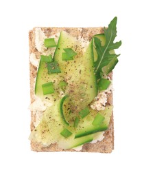 Photo of Fresh crunchy crispbreads with cream cheese, cucumber, green onion and arugula isolated on white, top view