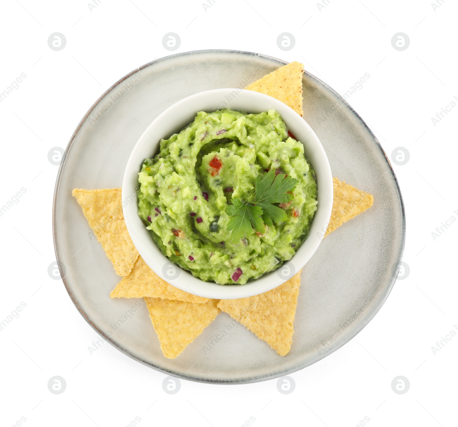 Photo of Delicious guacamole served with nachos chips isolated on white, top view