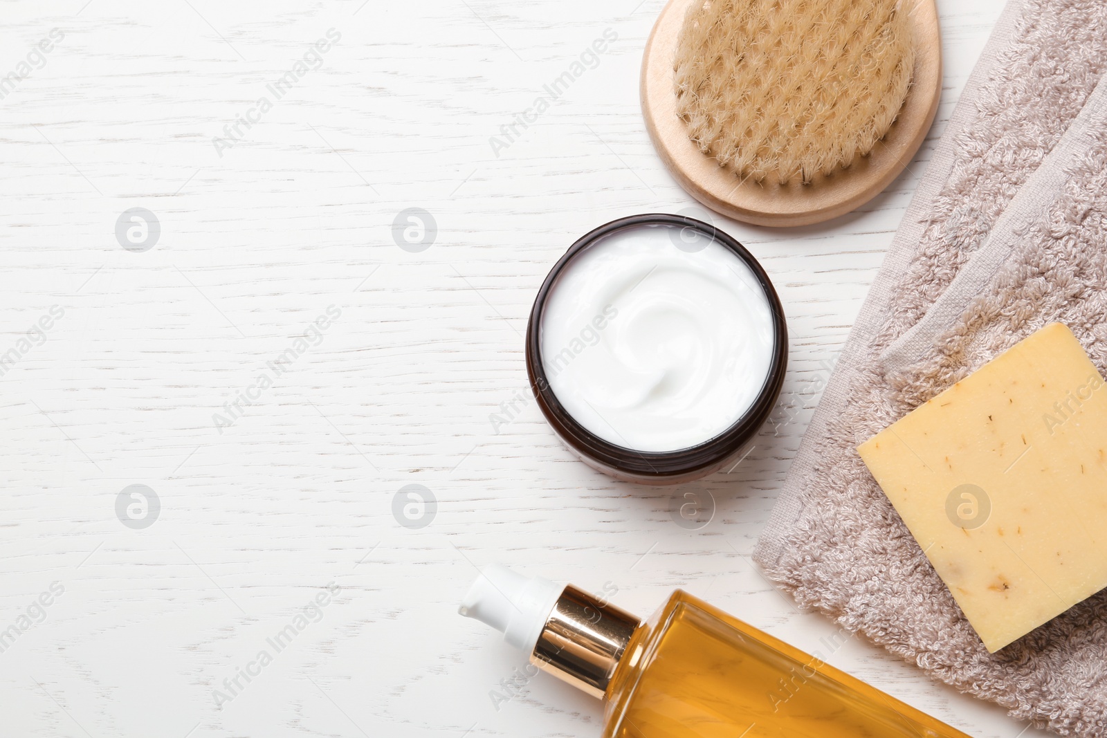 Photo of Flat lay composition with body care products and space for text on white wooden background