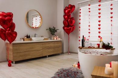 Photo of Stylish bathroom decorated for Valentine's day. Interior design
