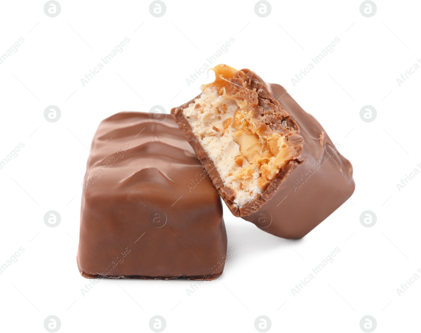 Photo of Chocolate bars with caramel, nuts and nougat isolated on white