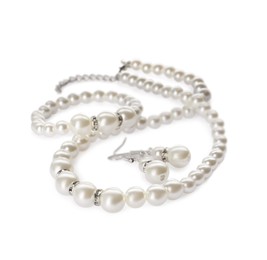 Photo of Elegant pearl necklace, bracelet and earrings on white background