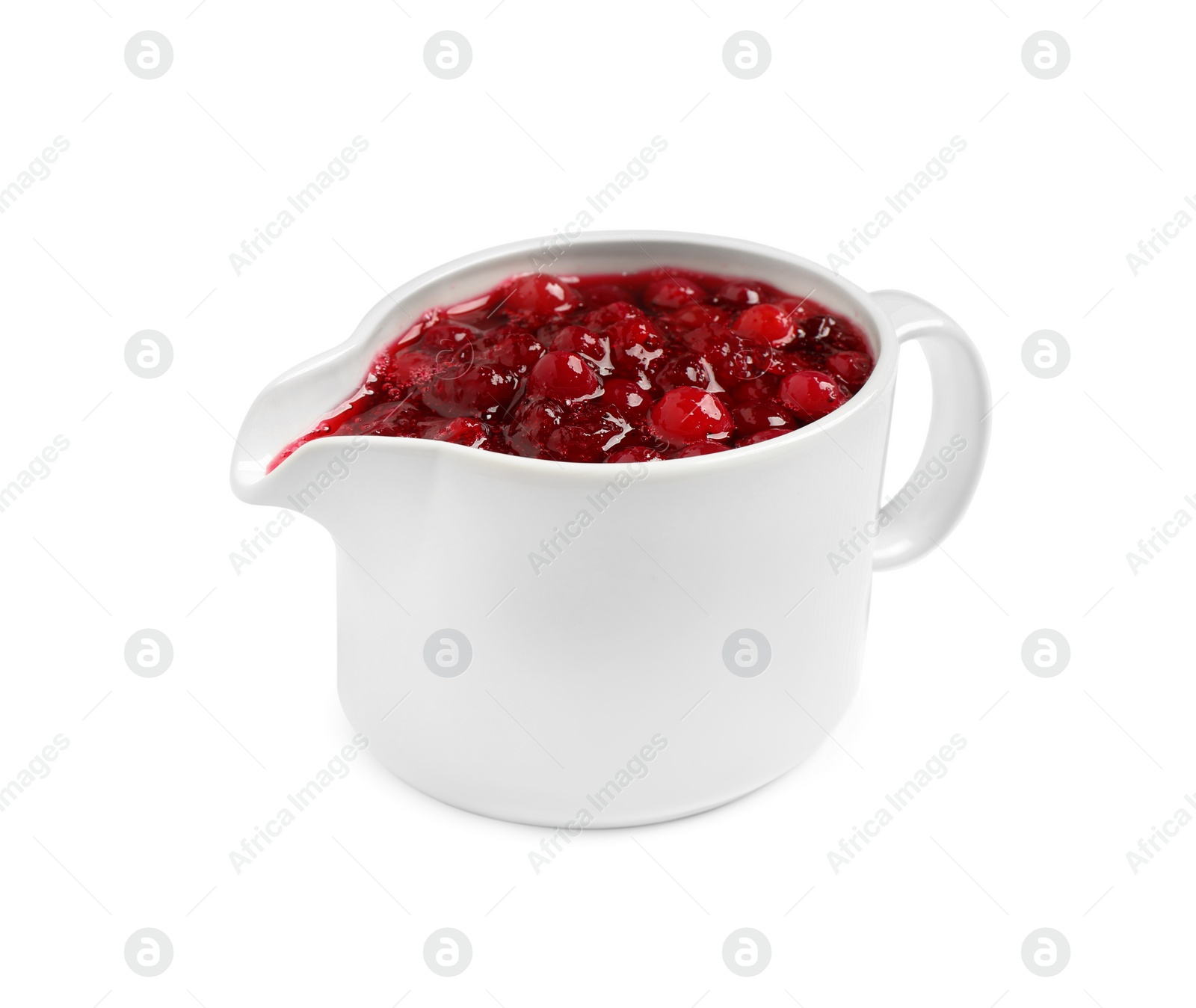 Photo of Cranberry sauce in pitcher isolated on white