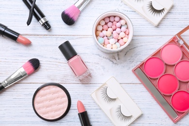 Flat lay composition with cosmetic products on wooden background