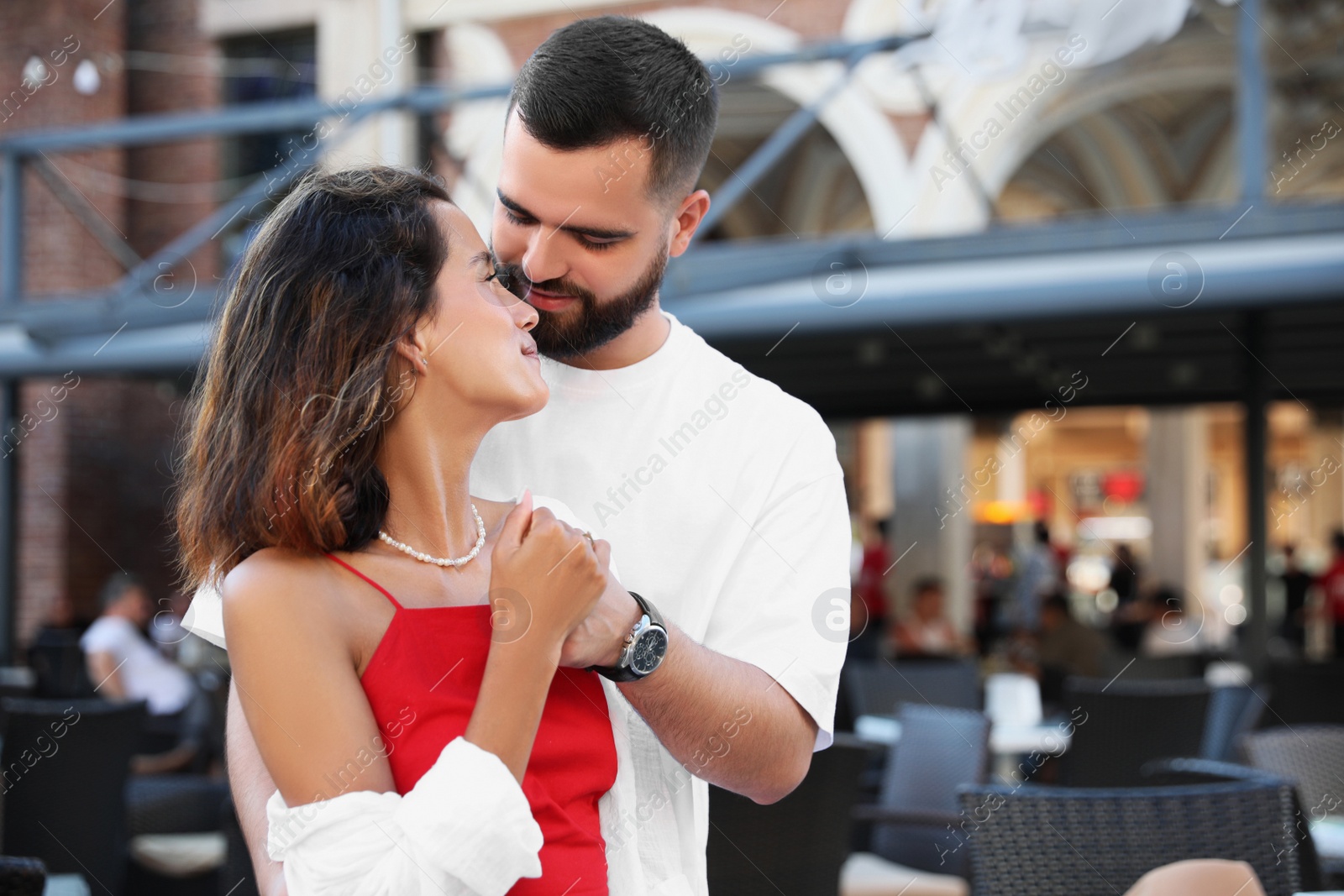 Photo of Happy young couple together on city street