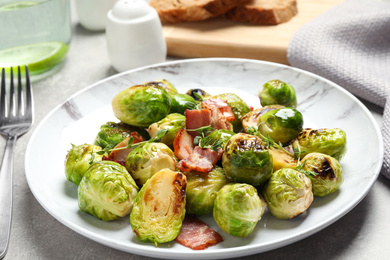 Image of Delicious fried Brussels sprouts with bacon served on table