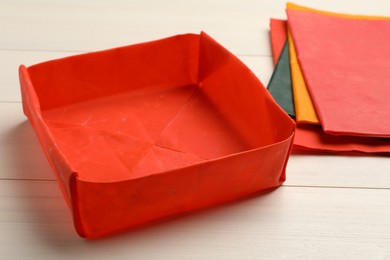 Box made of beeswax food wrap on white wooden table