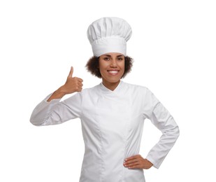 Photo of Happy female chef in uniform showing thumb up on white background
