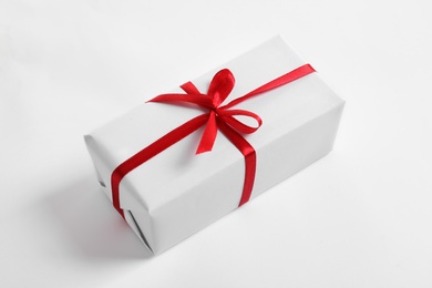 Photo of Beautifully wrapped gift box on white background