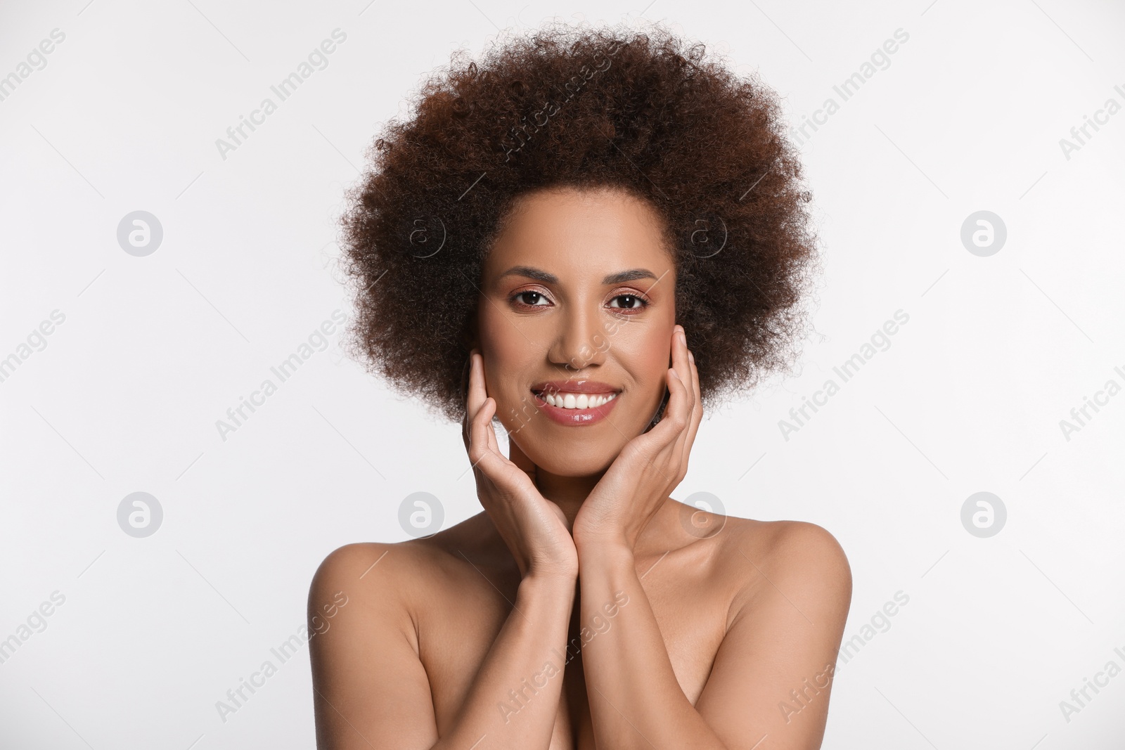 Photo of Portrait of beautiful young woman with glamorous makeup on white background