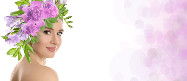 Young woman with beautiful makeup wearing flower wreath on light background, space for text. Banner design