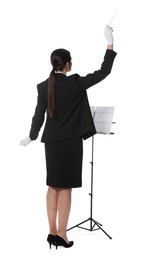 Photo of Professional conductor with baton and note stand on white background, back view