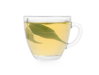 Fresh green tea in glass cup and leaves isolated on white