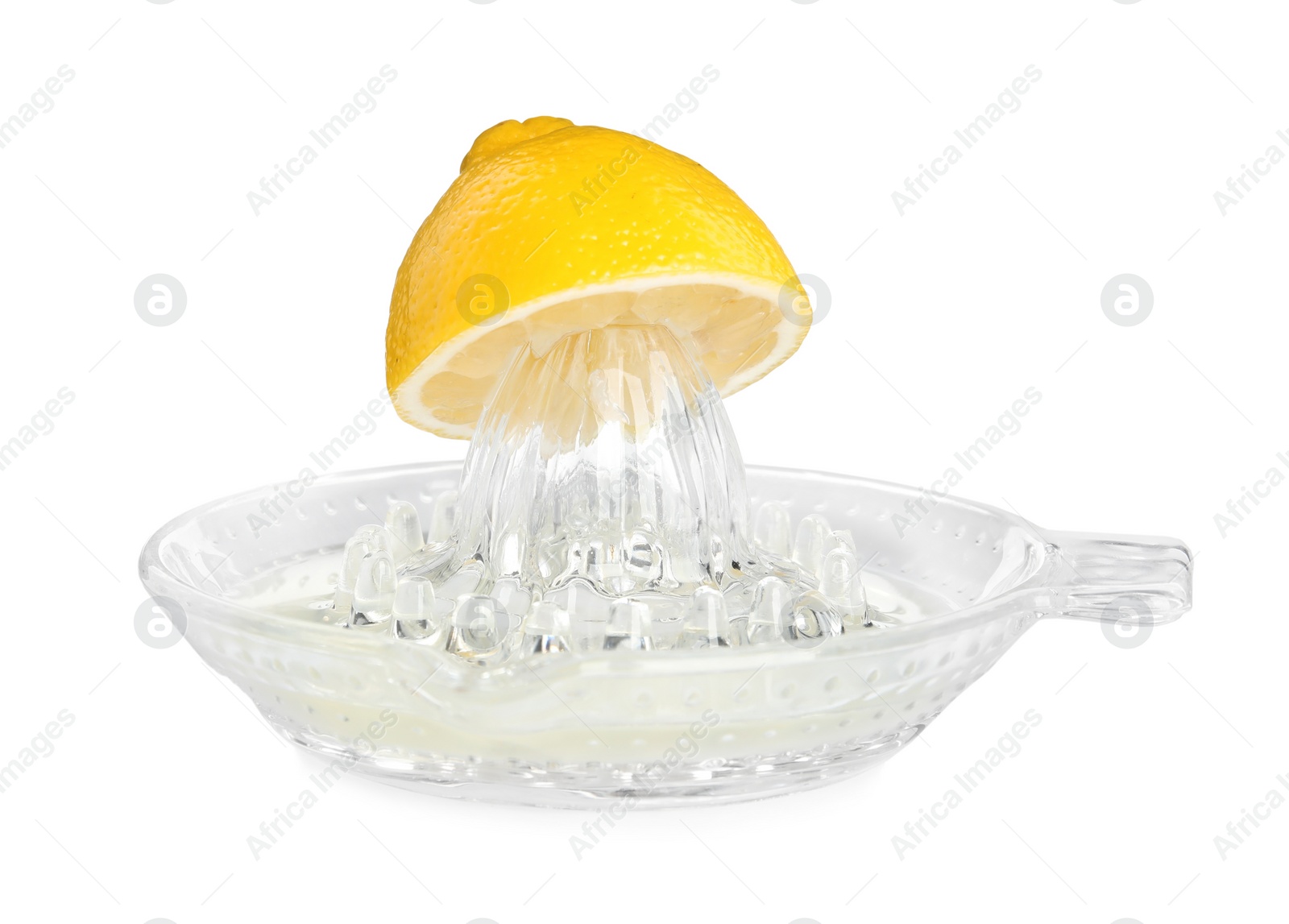 Photo of Glass squeezer and halved fresh lemon on white background