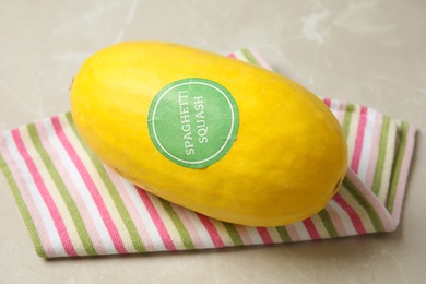 Photo of Whole ripe spaghetti squash on gray table