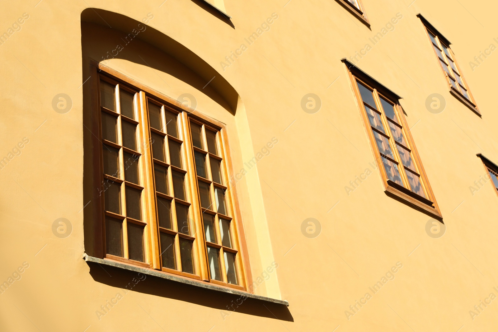 Photo of Building with windows on sunny day, view from outdoors