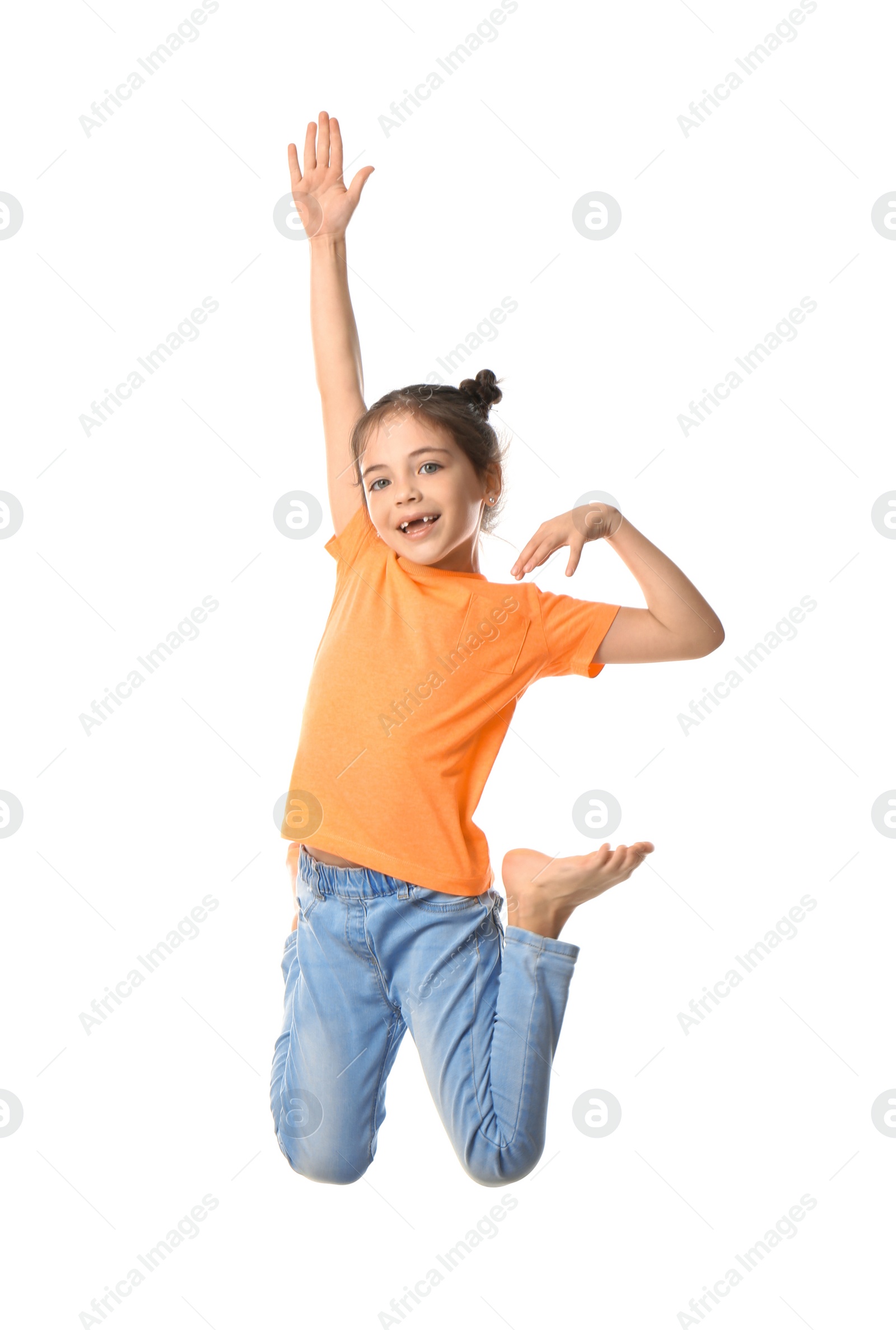 Photo of Cute little girl jumping on white background