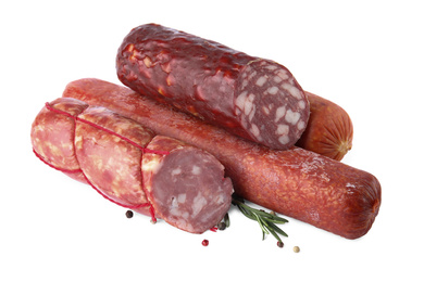 Different types of sausages on white background