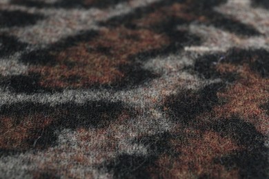 Texture of beautiful fabric with animal pattern as background, closeup