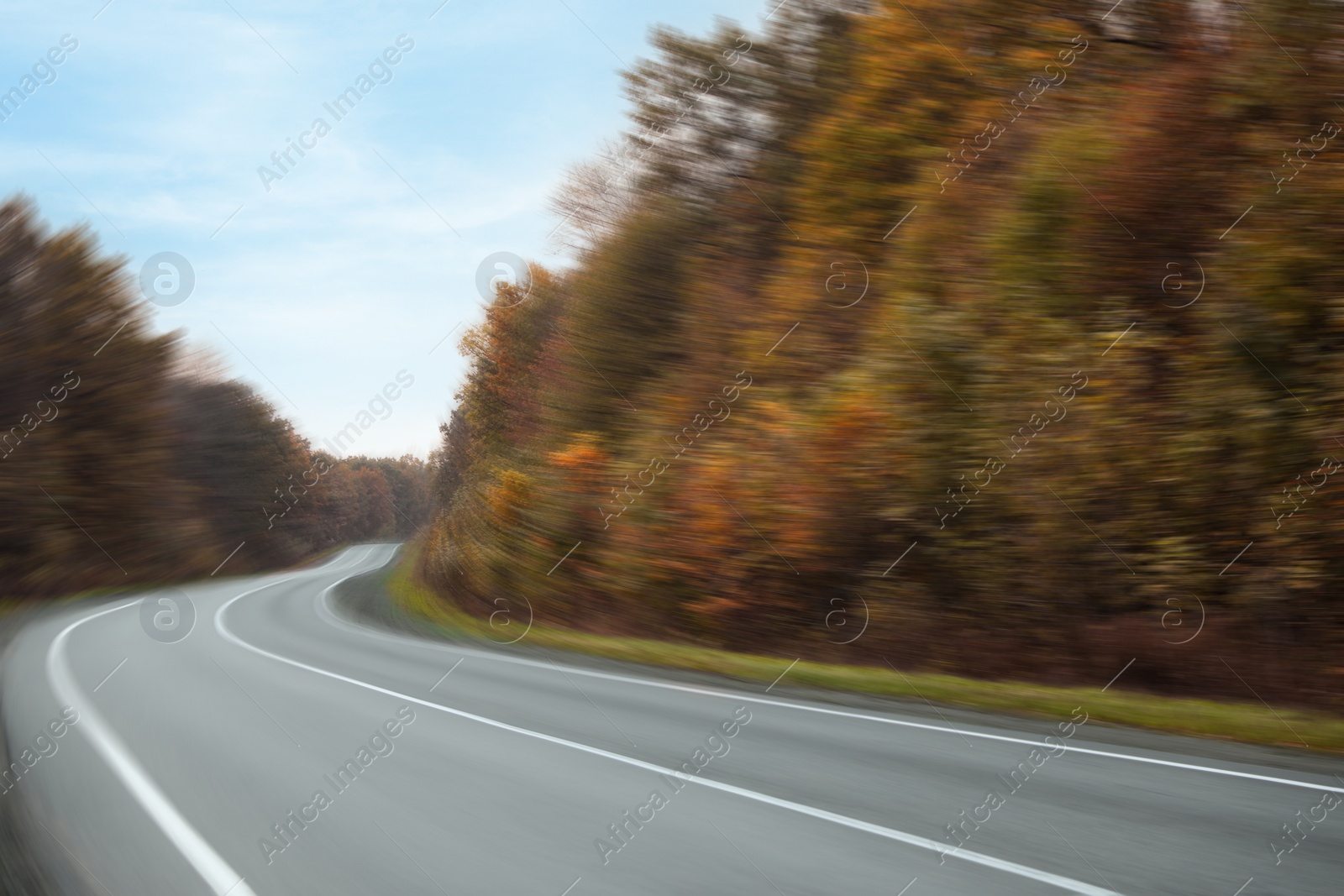 Image of Asphalt country road without transport in autumn, motion blur effect