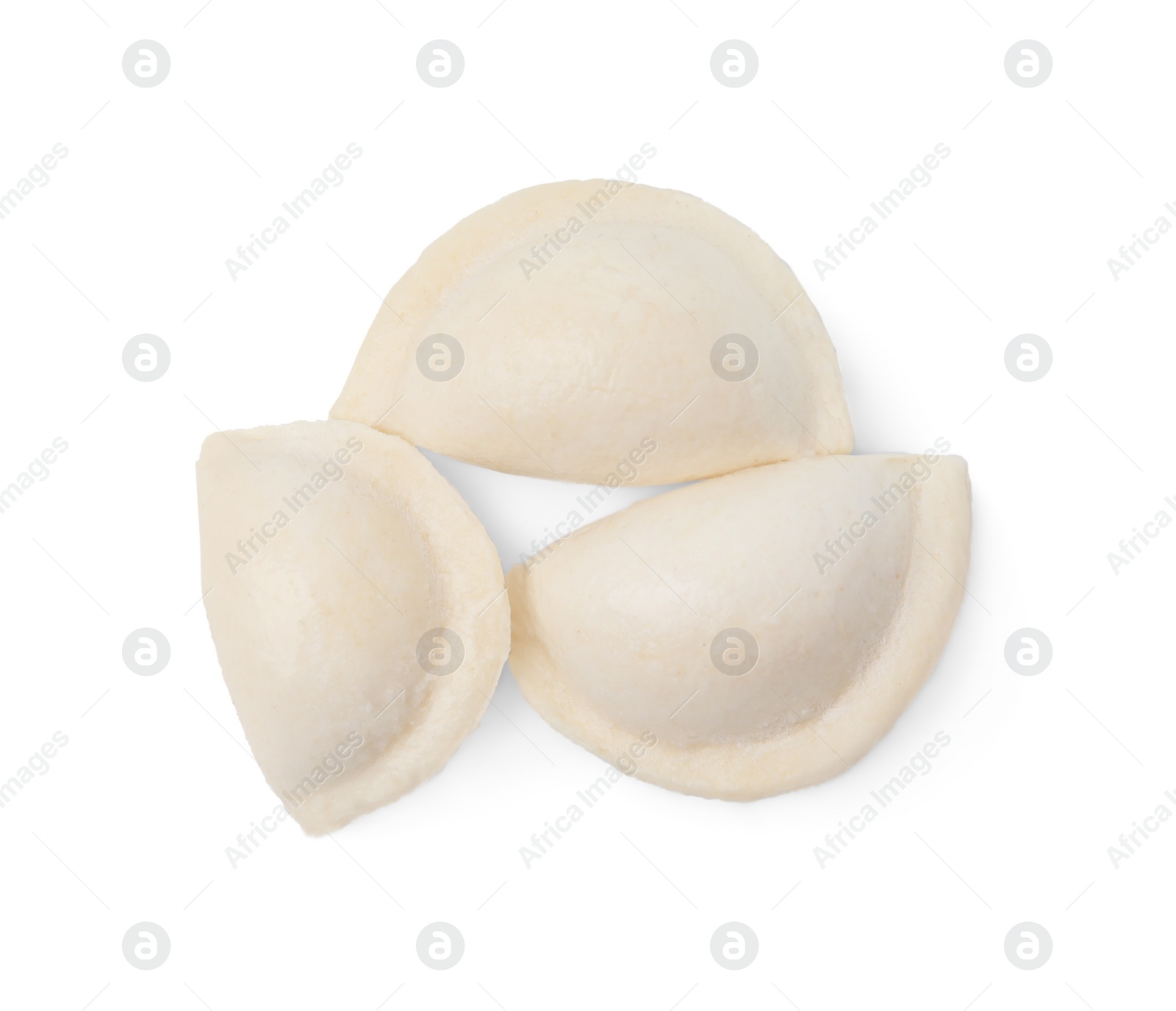 Photo of Raw dumplings (varenyky) with cottage cheese isolated on white, top view