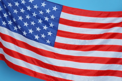 Photo of National United states of America flag on light blue background