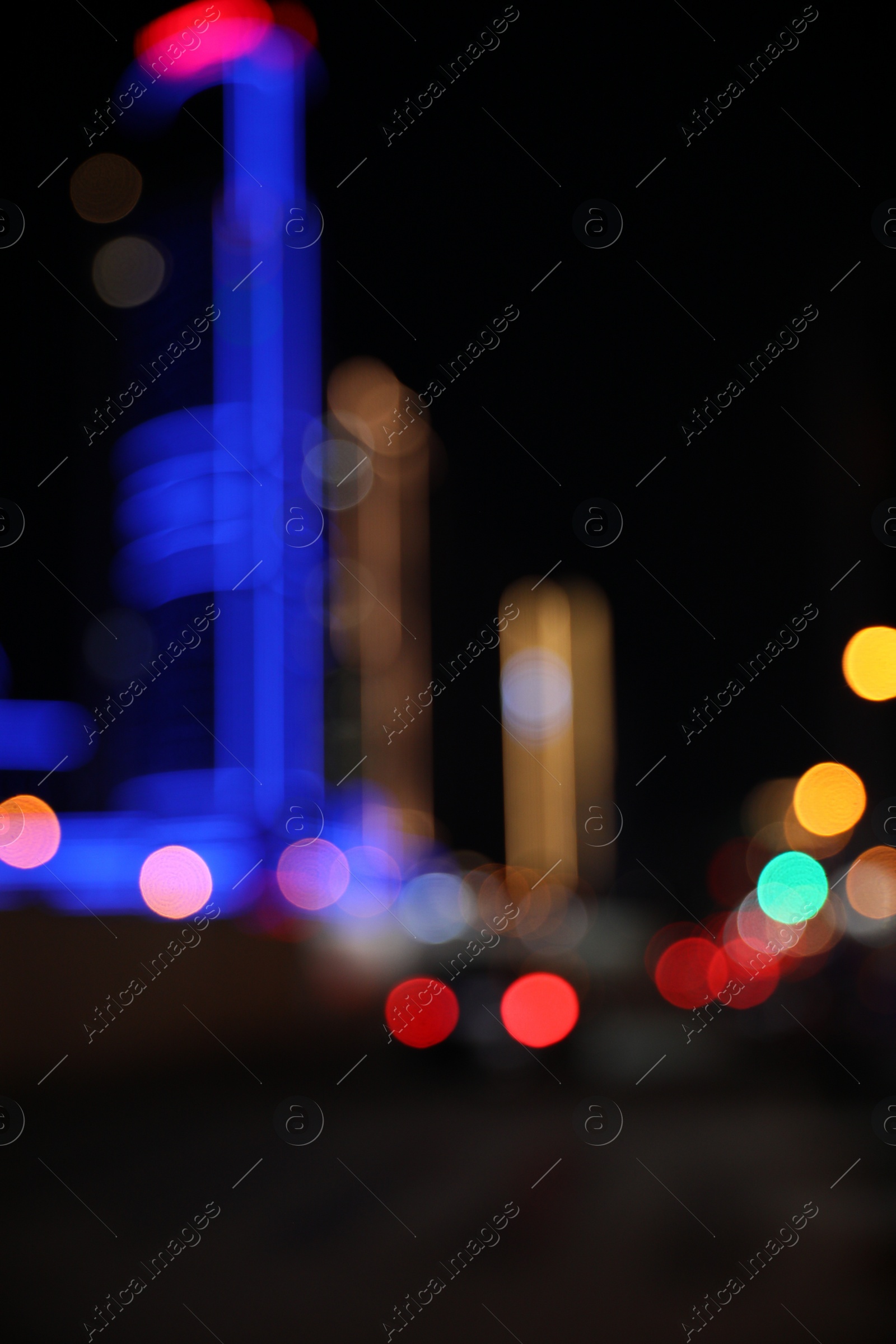 Photo of Blurred view of cityscape with bokeh effect. Night life