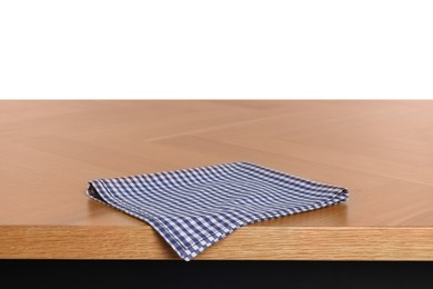 Photo of Checkered tablecloth on wooden table against white background