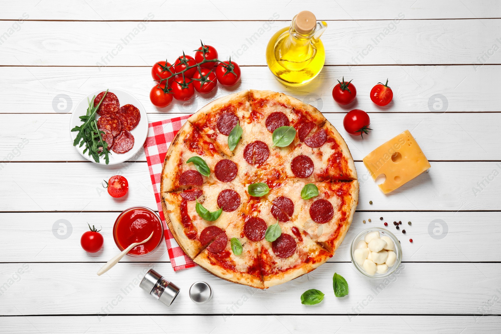 Photo of Flat lay composition with hot pepperoni pizza on white wooden table