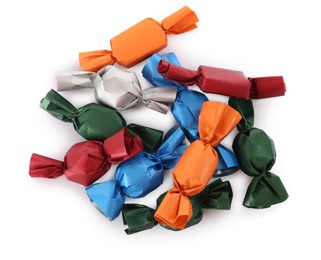 Photo of Many candies in colorful wrappers on white background, top view