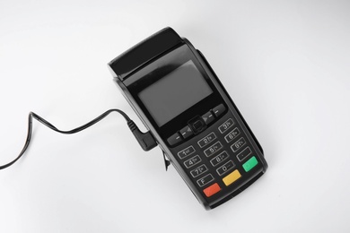 Photo of Modern payment terminal on white background, top view