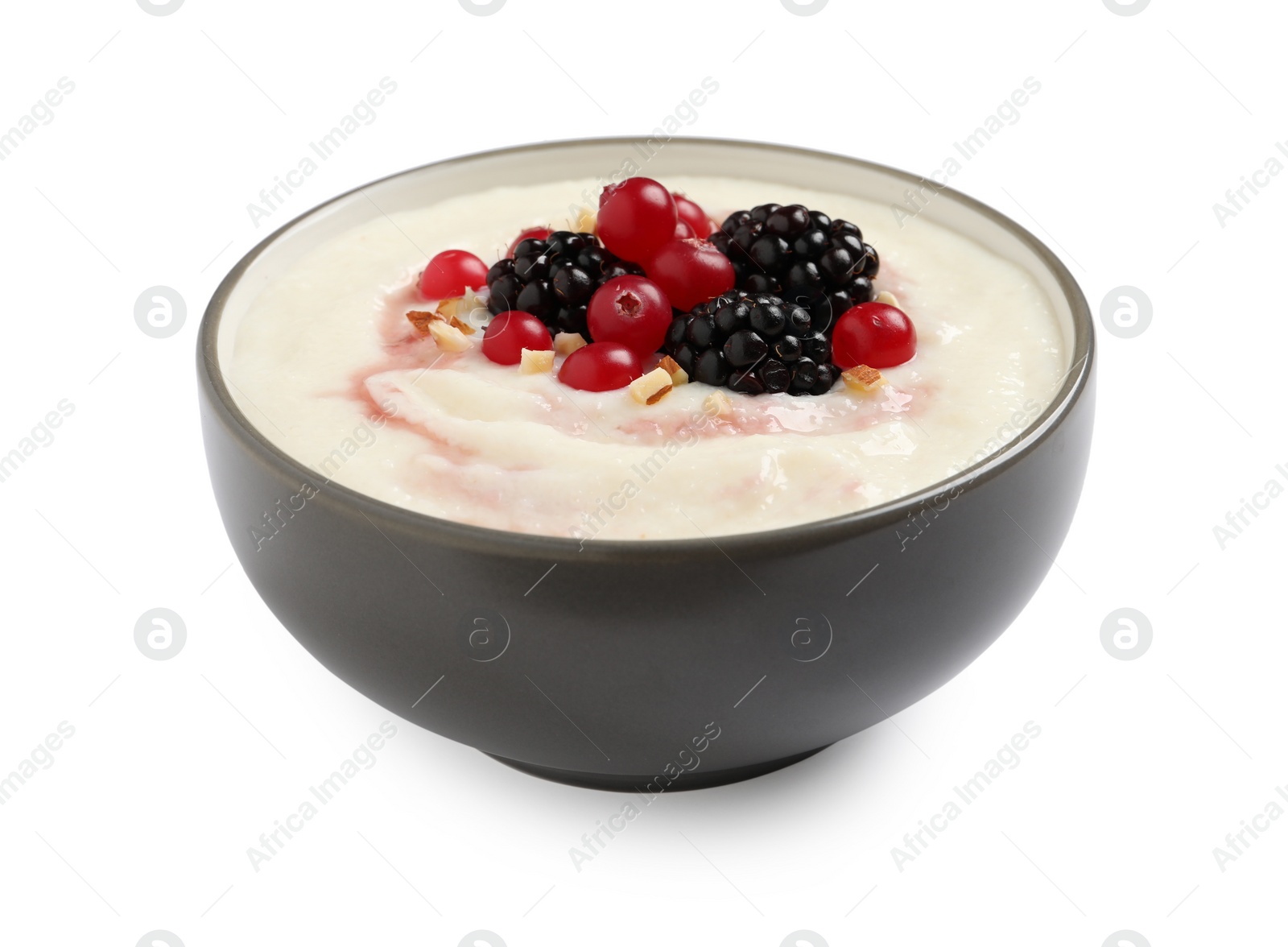 Photo of Delicious semolina pudding with berries isolated on white