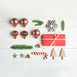 Flat lay composition with Christmas decor on white wooden background