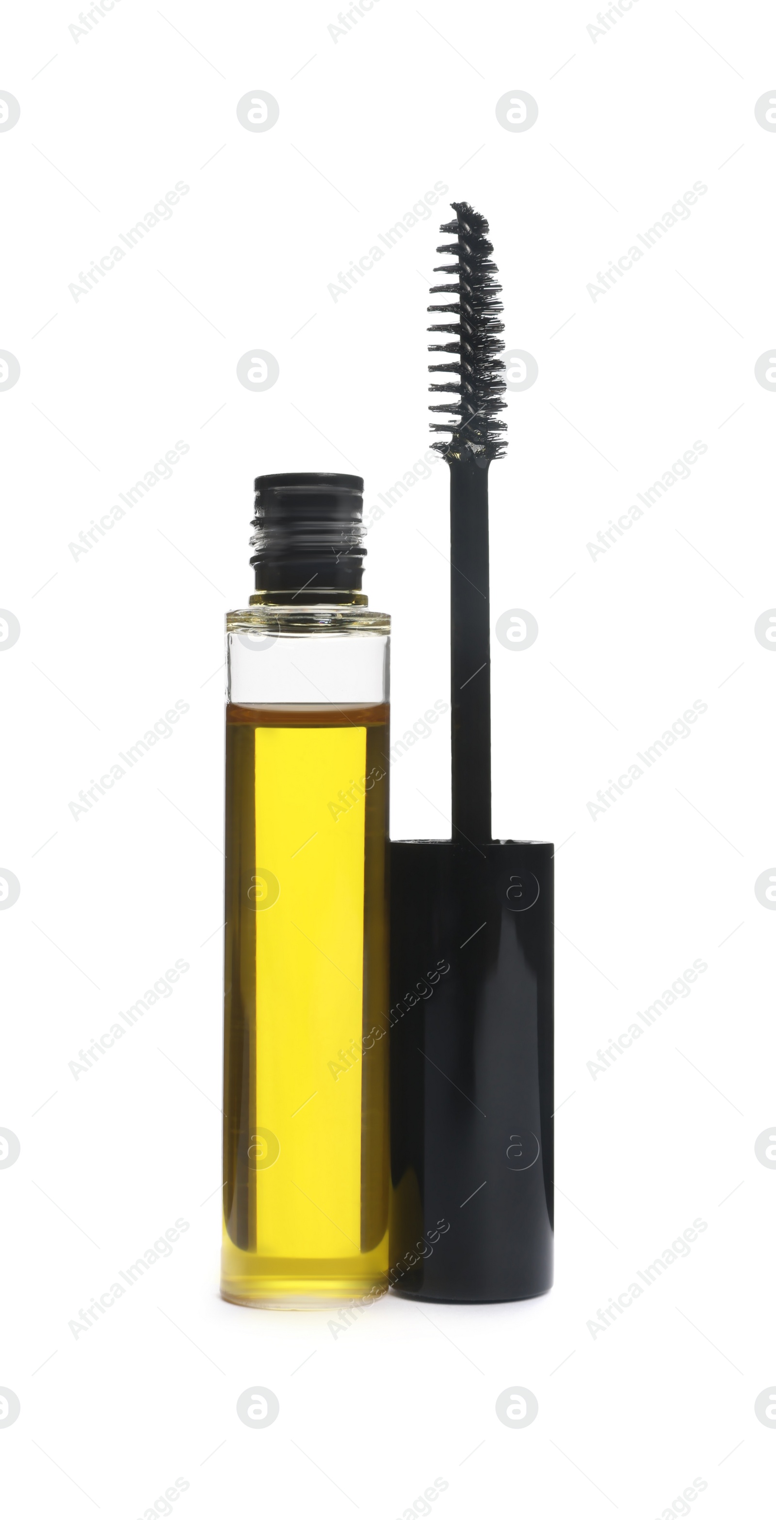 Photo of Tube of eyelash oil and brush isolated on white