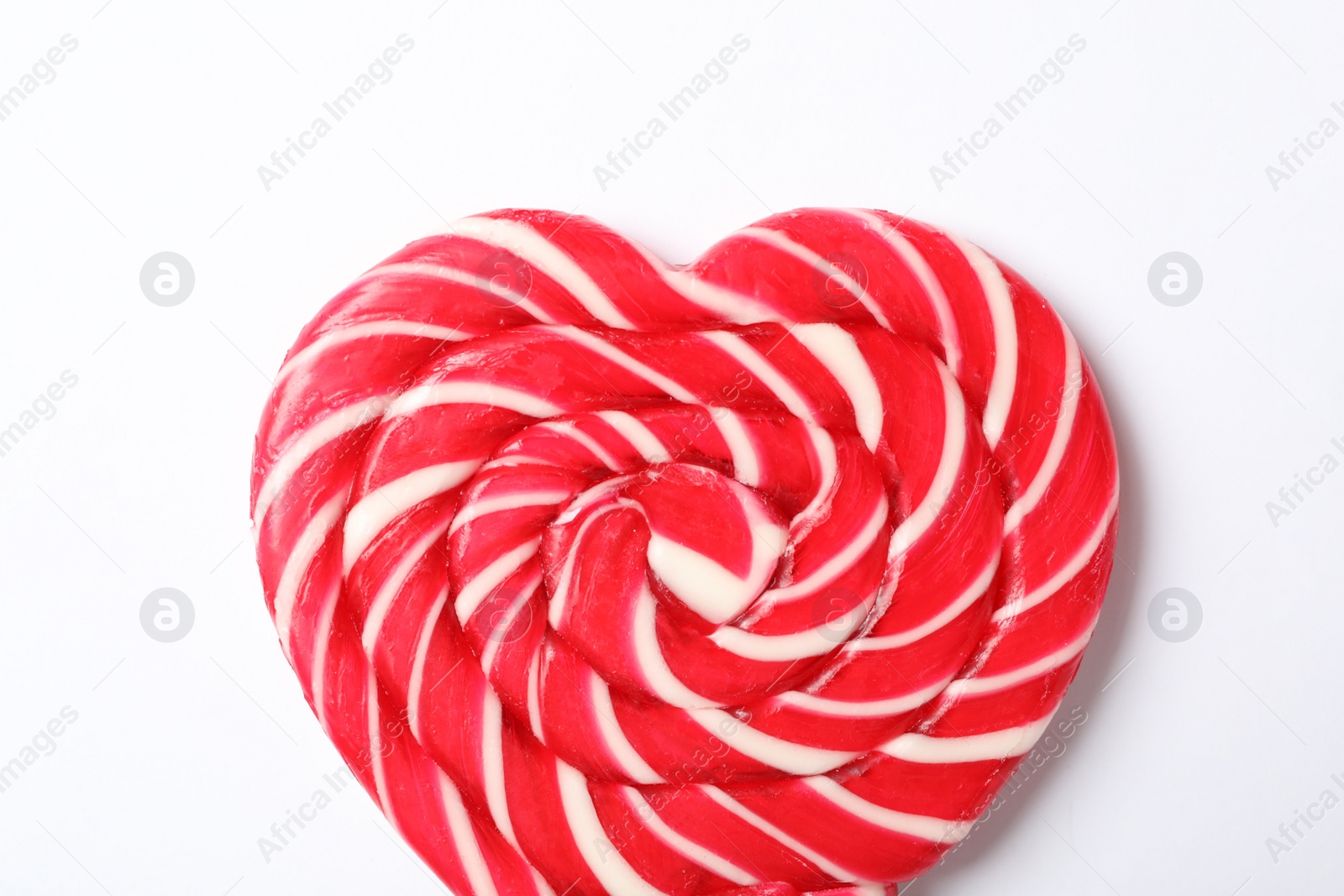 Photo of Sweet heart shaped lollipop on white background, top view. Valentine's day celebration