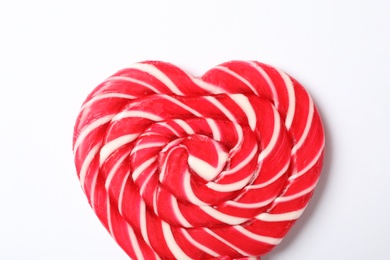 Photo of Sweet heart shaped lollipop on white background, top view. Valentine's day celebration