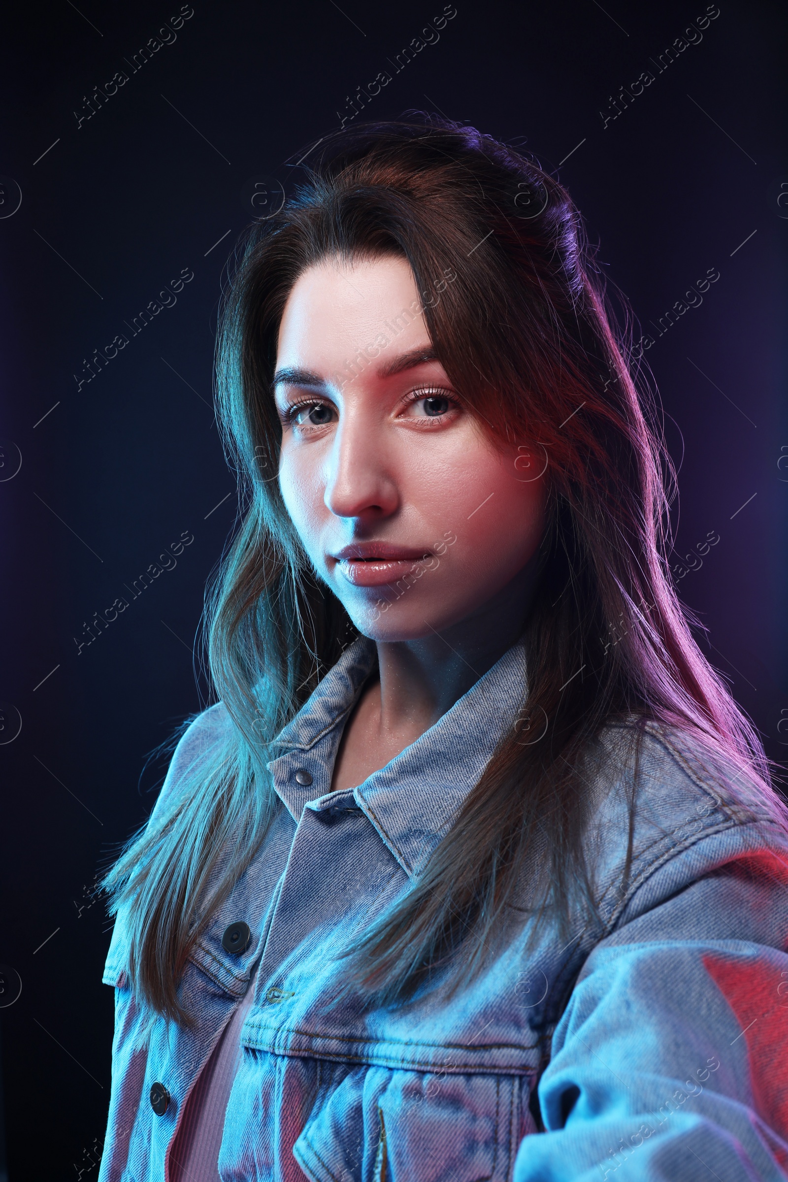 Photo of Portrait of beautiful young woman on color background