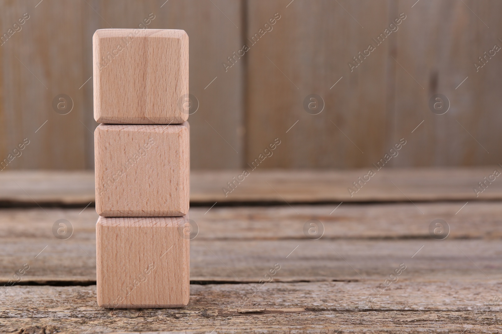 Photo of International Organization for Standardization. Cubes with abbreviation ISO on wooden table, space for text