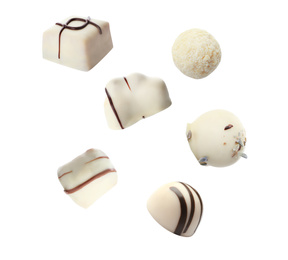 Image of Falling different chocolate candies on white background