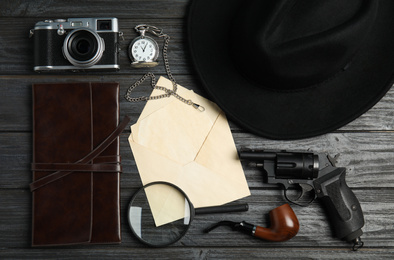 Photo of Flat lay composition with vintage detective items on grey wooden background