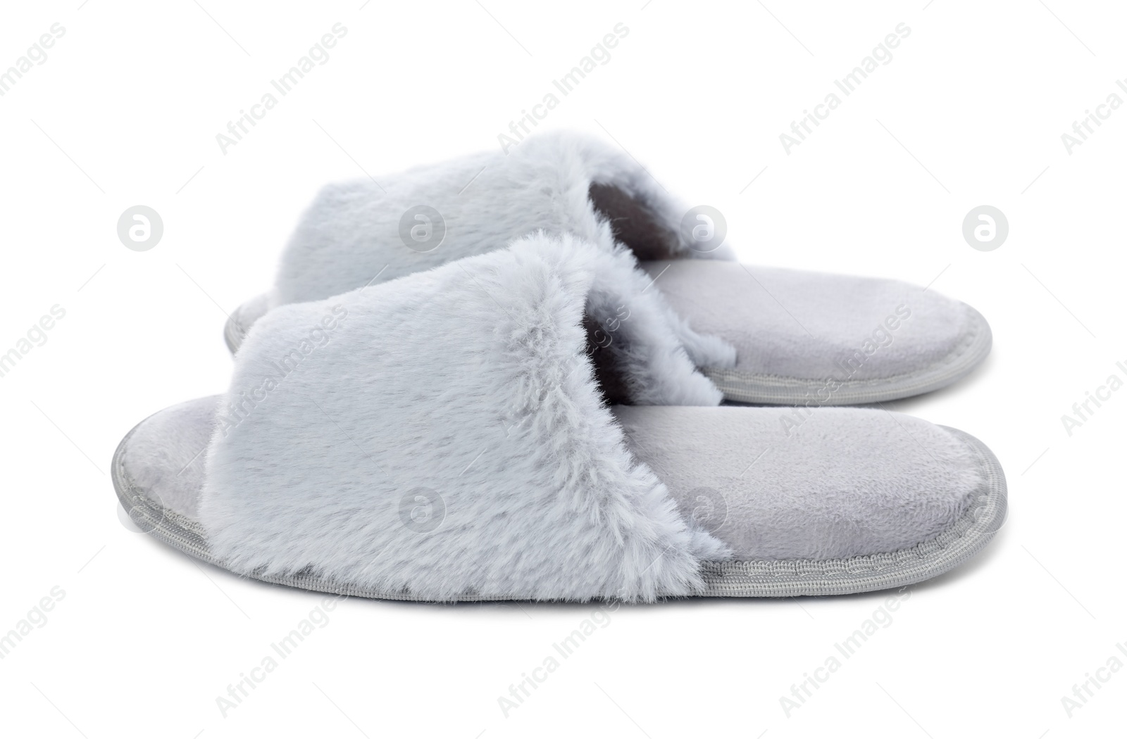 Photo of Pair of soft slippers with fur isolated on white