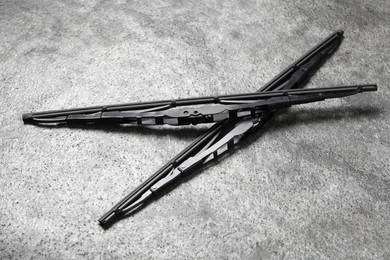 Photo of Car windshield wipers on grey stone background