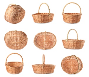 Set with empty wicker baskets on white background