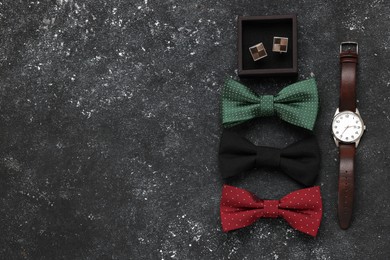Photo of Flat lay composition with stylish color bow ties on grey background. Space for text