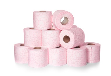 Photo of Color toilet paper rolls on white background