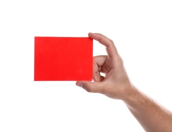 Football referee holding red card on white background, closeup