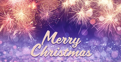 Image of Text Merry Christmas on festive background with fireworks. Bokeh effect