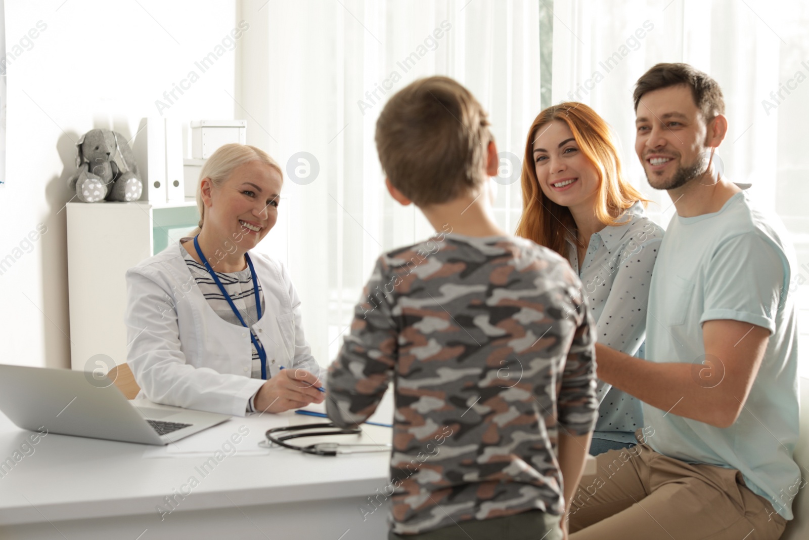 Photo of Family with child visiting doctor in hospital