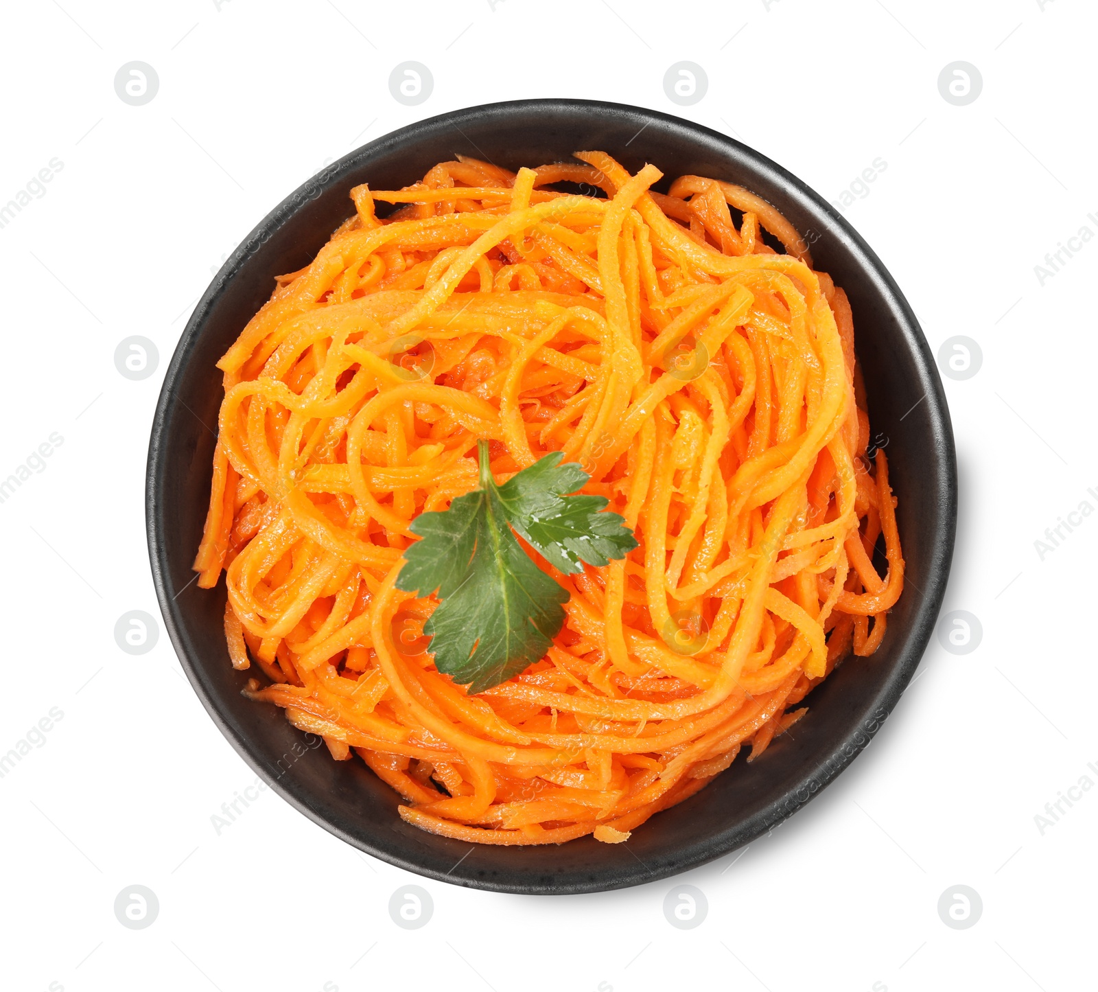 Photo of Delicious Korean carrot salad with parsley in bowl isolated on white, top view