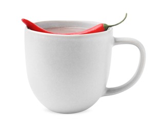 Cup of hot chocolate with chili pepper on white background
